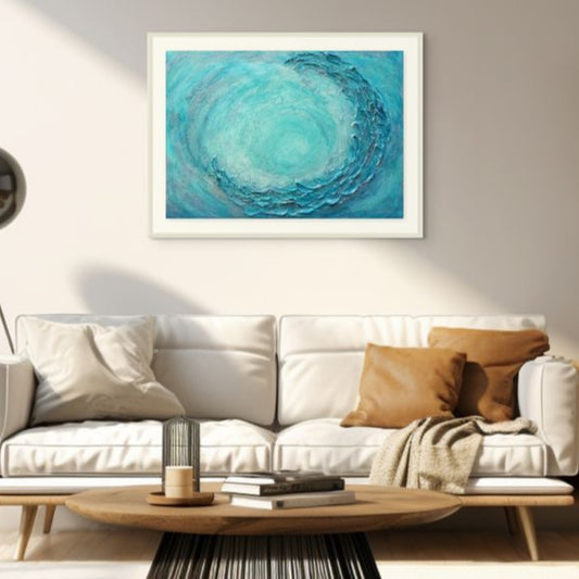 Modern living room with a white sofa, wooden coffee table, and abstract blue artwork on the wall.