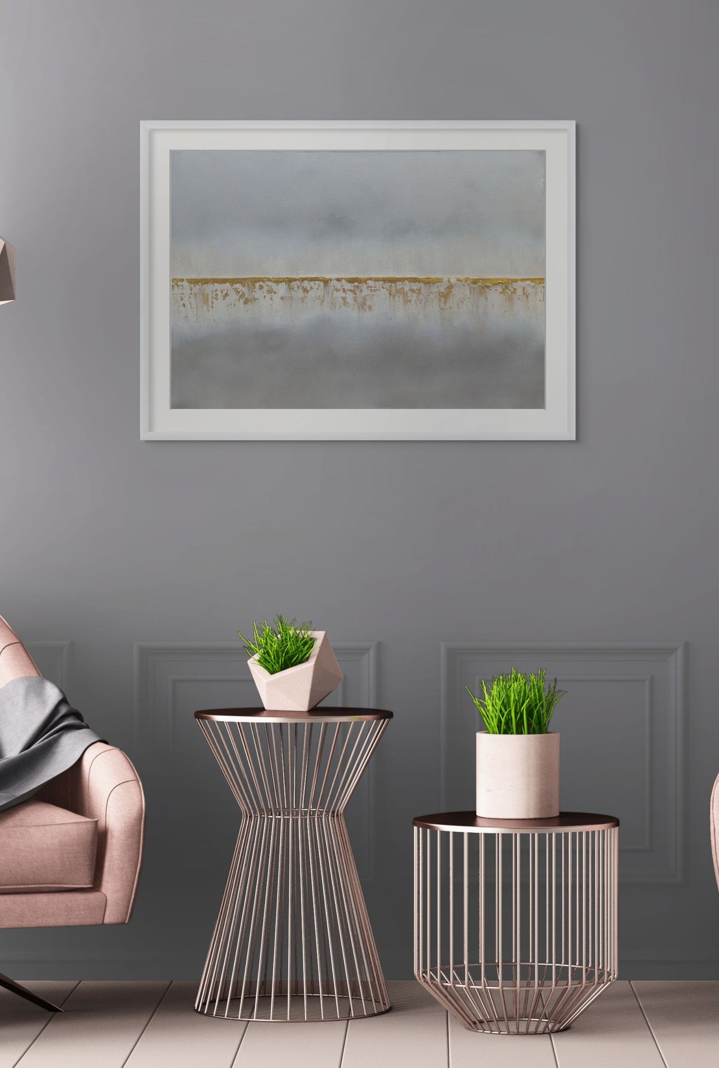 Modern living room with side tables, potted plants, and a framed artwork on a gray wall.