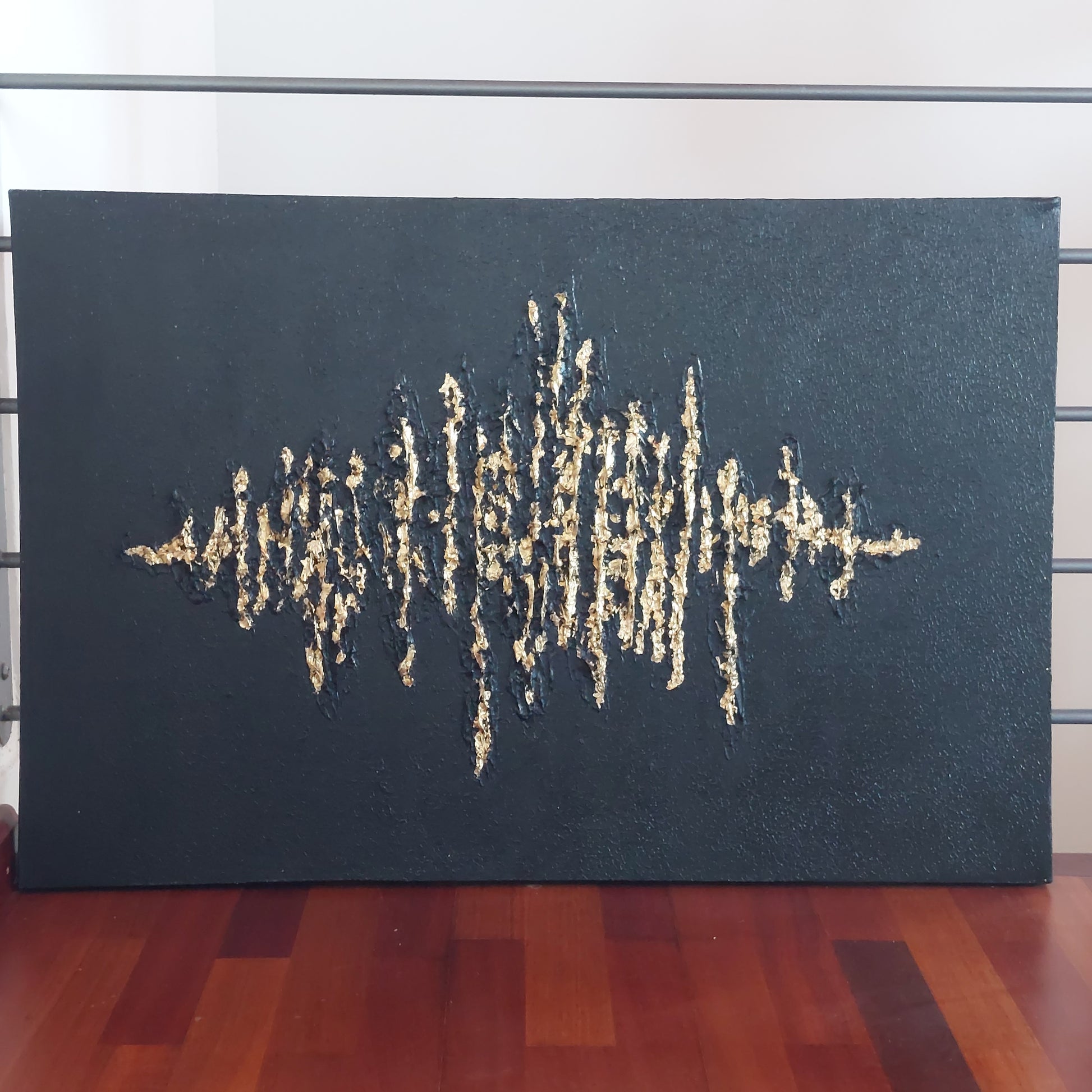 Black textured painting with gold leaf overlay