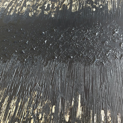 Close up of Black and gold textured painted canvas