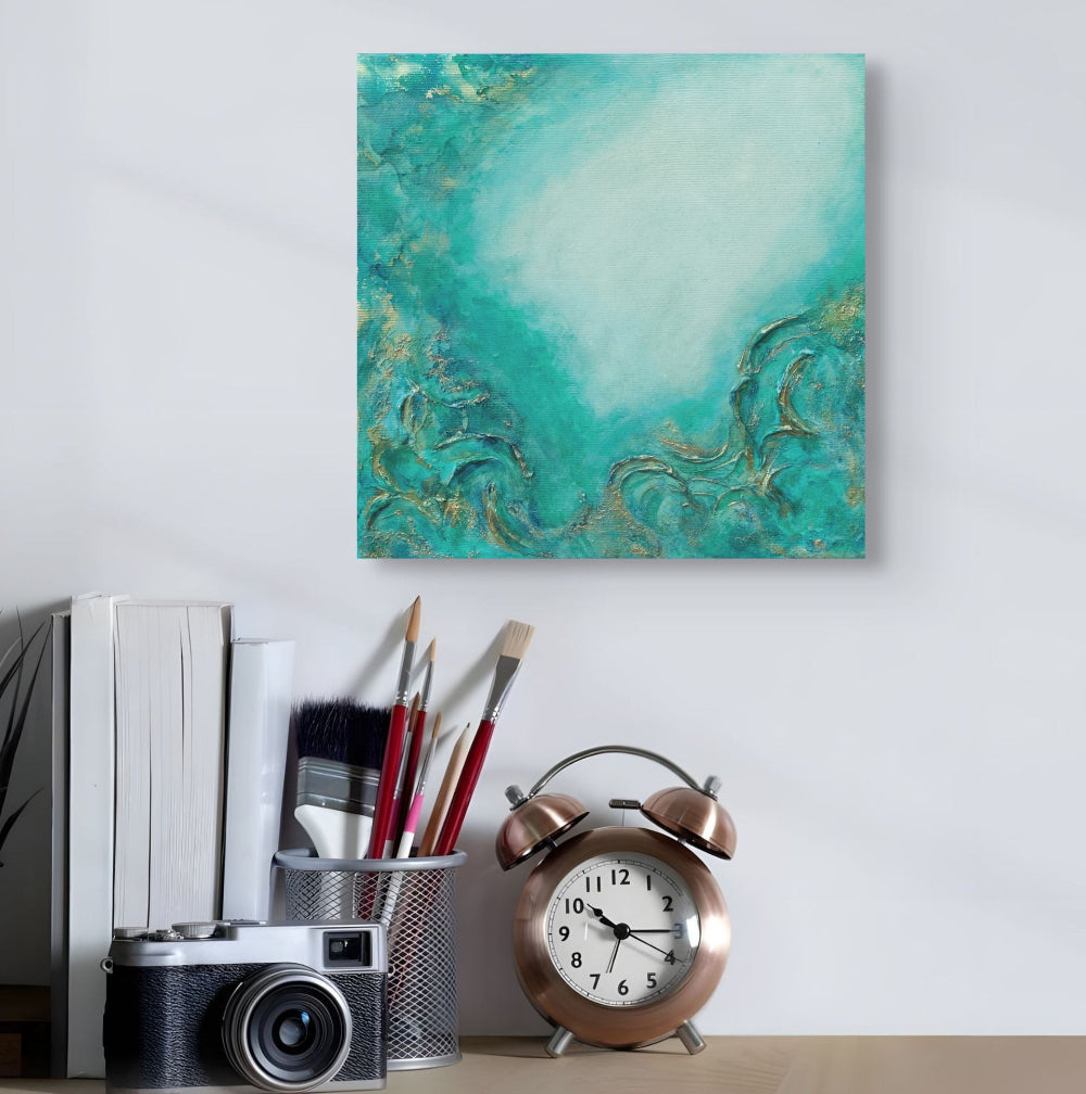 Teal abstract painting on a wall above a desk with a camera, brushes, and alarm clock. From the Depths, Original Canvas Painting