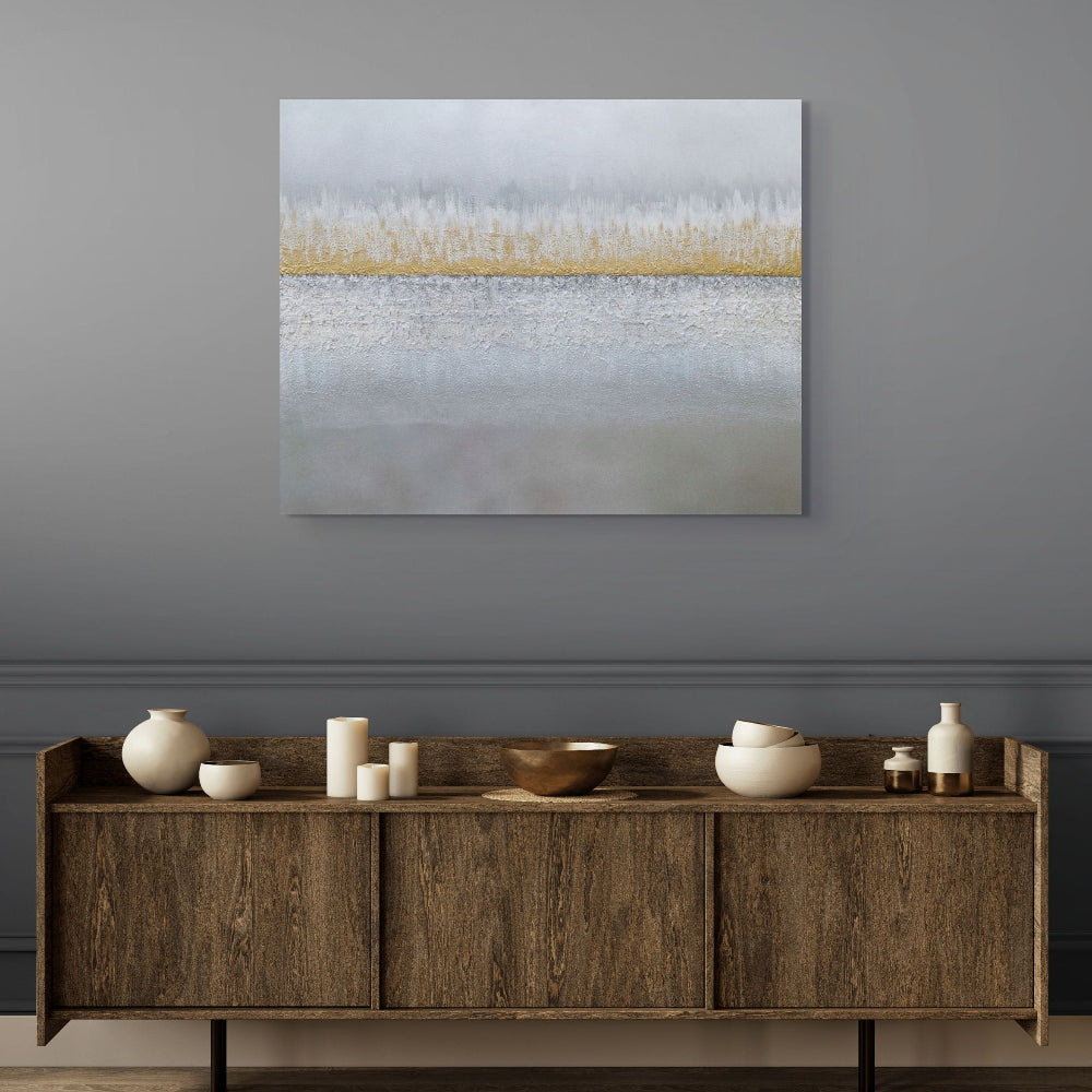 Wooden sideboard with decorative items against a gray wall with a large abstract painting. Earthed original canvas painting by Julie Bevan.