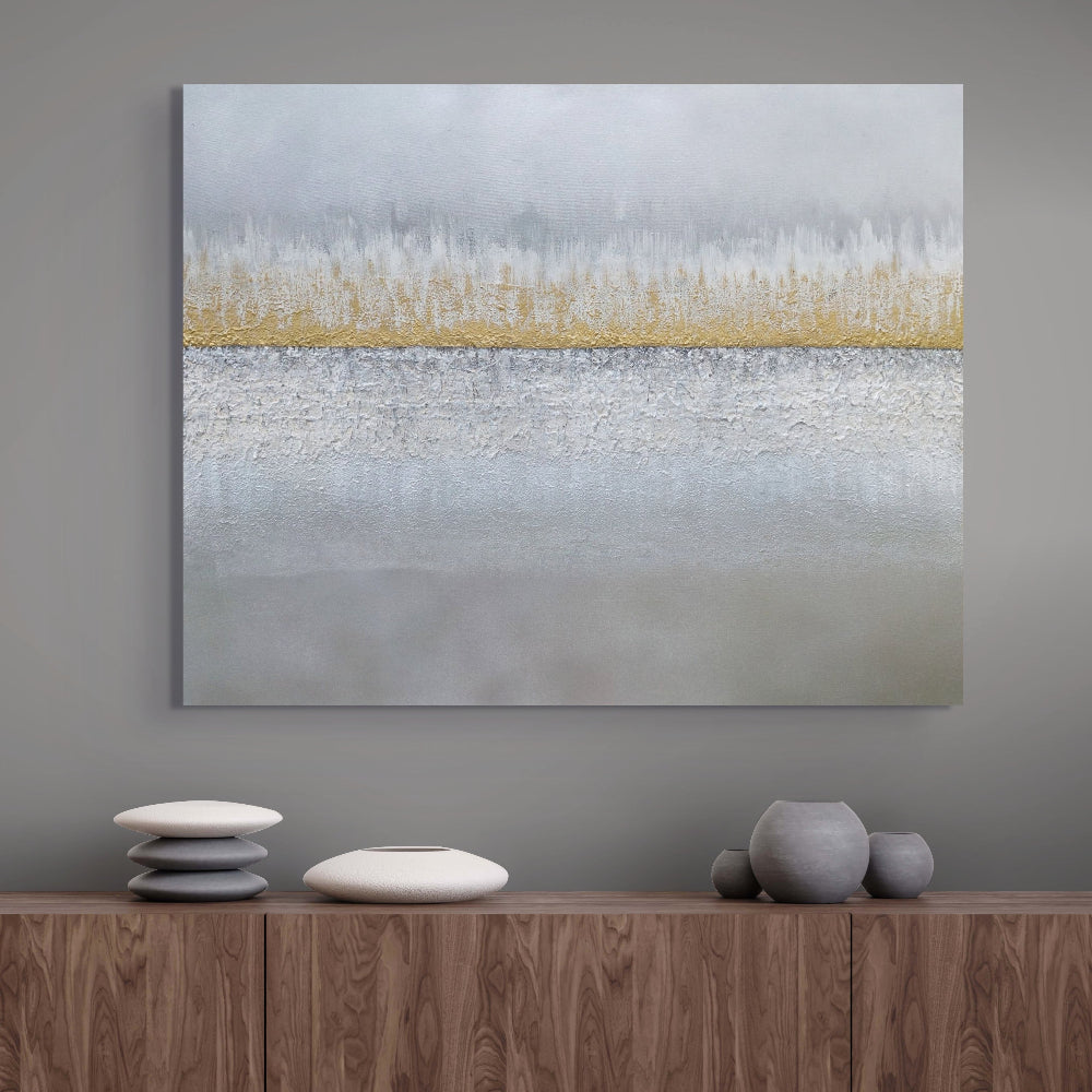 Abstract painting on a wall above a wooden console table with decorative items. Earthed original canvas painting by Julie Bevan.