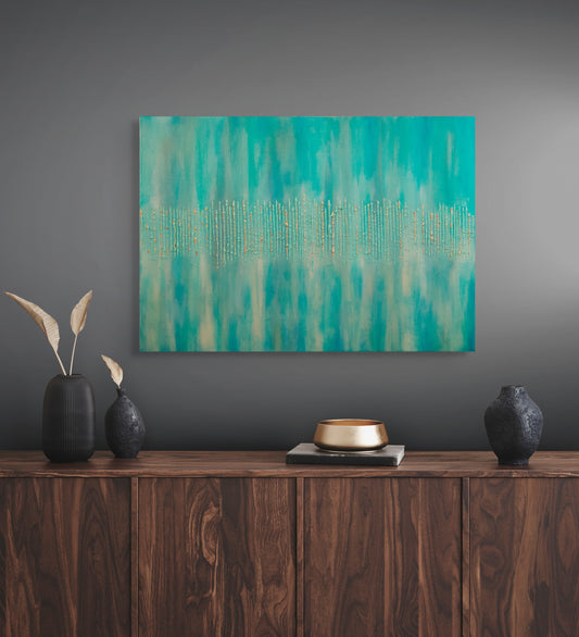 Abstract teal painting on a gray wall above a wooden console table with decorative items.