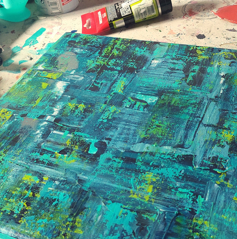 Abstract painting with teal, green, and black colors on a textured surface.