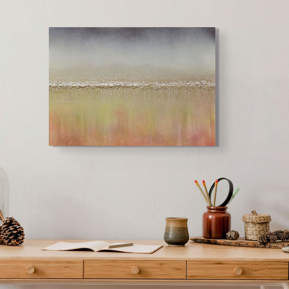 Abstract landscape painting on a wall above a wooden console table with decorative items. Otoño textured abstract original painting by Julie Bevan