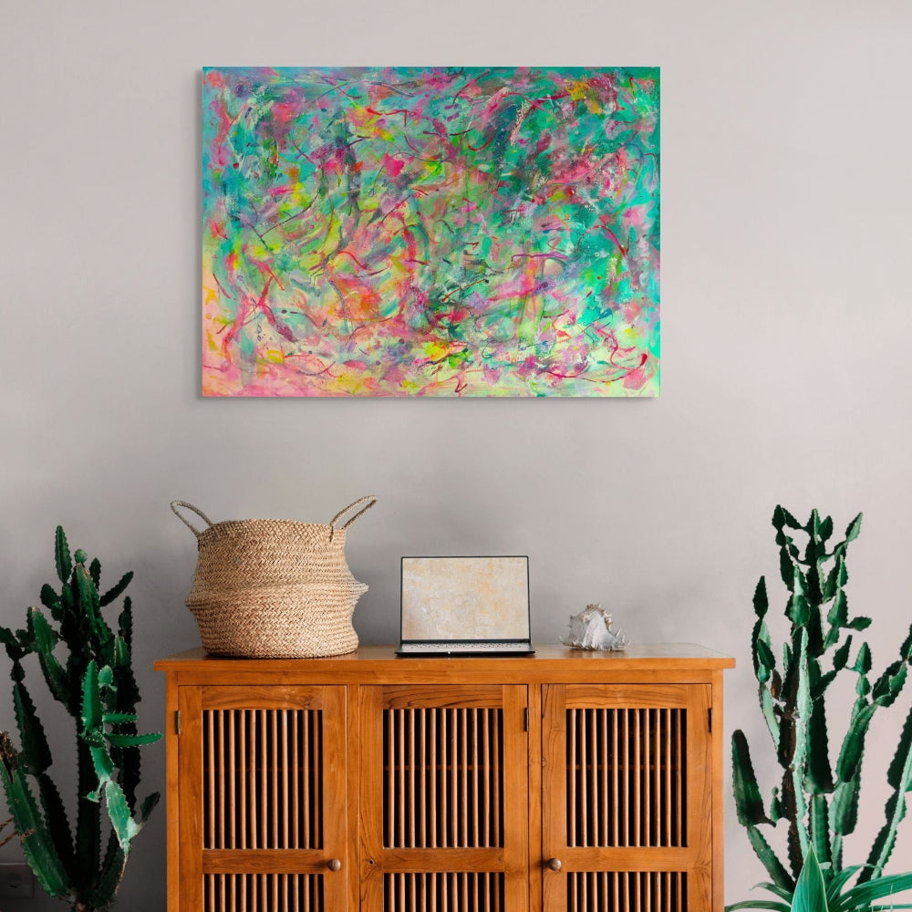 Abstract artwork with vibrant colours and dynamic brush strokes, original canvas art by Julie Bevan in living room setting
