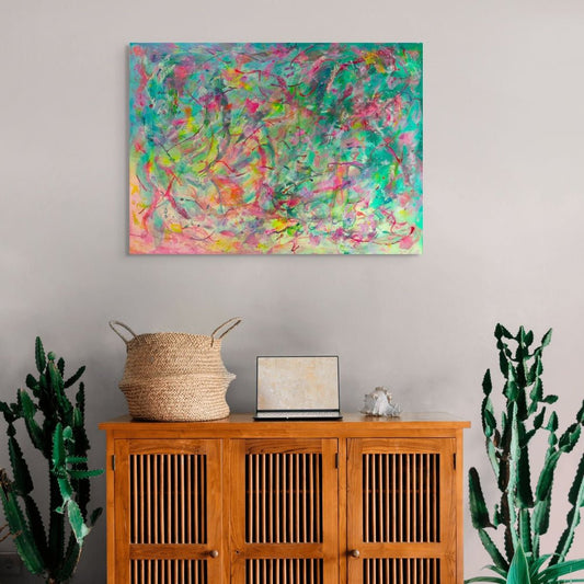 Abstract artwork with vibrant colours and dynamic brush strokes, original canvas art by Julie Bevan in living room setting
