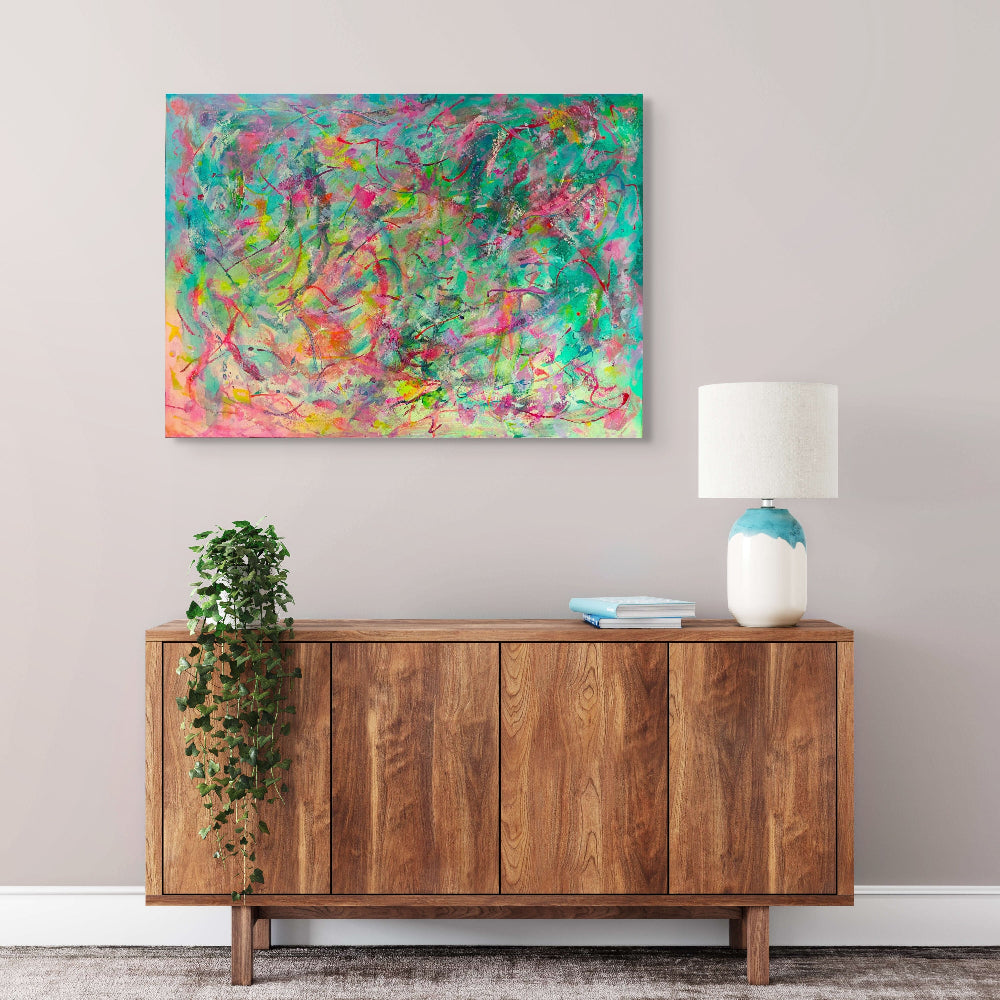 Abstract artwork with vibrant colours and dynamic brush strokes, original canvas art by Julie Bevan in living room setting
