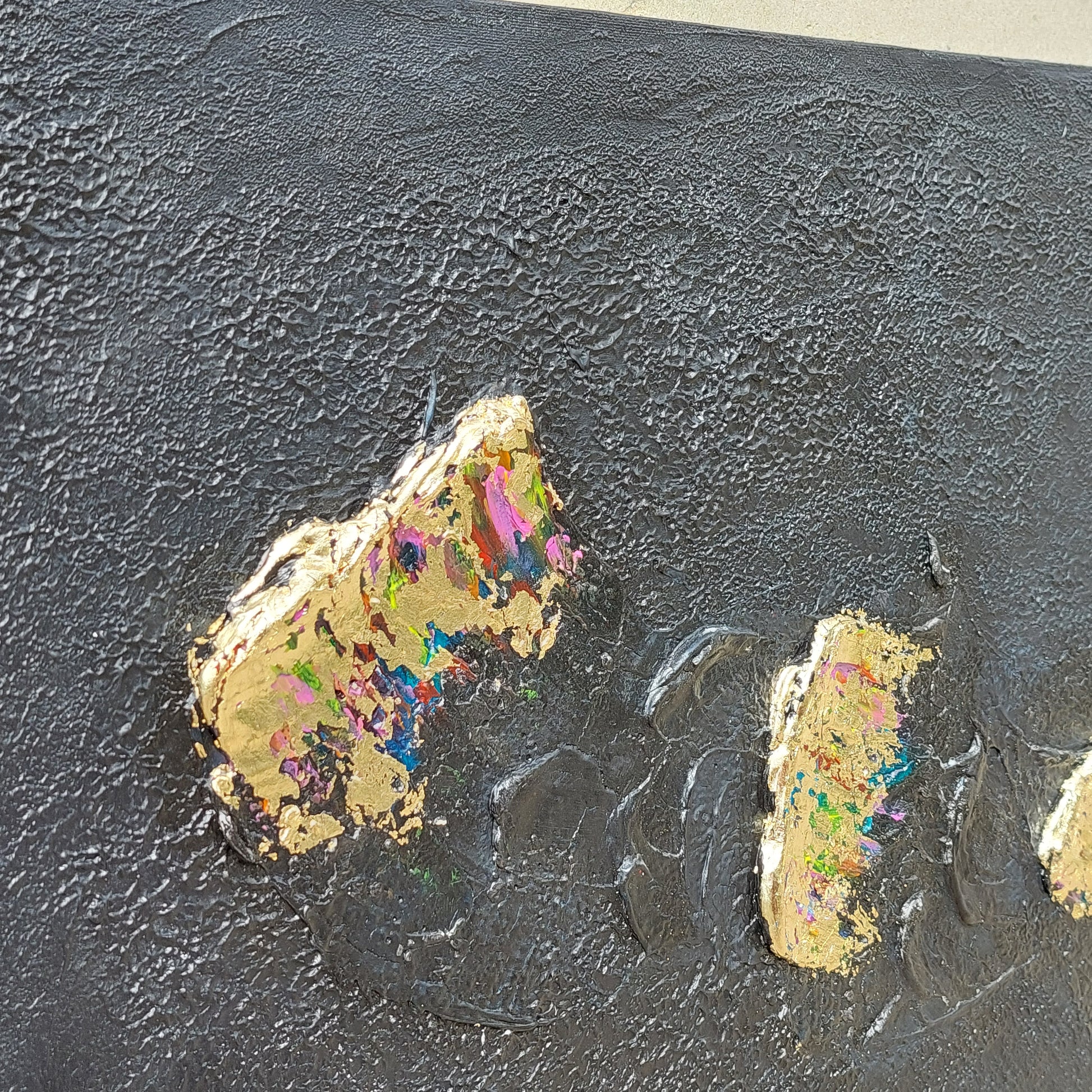 Black and multicolour acrylic canvas art with gold leaf