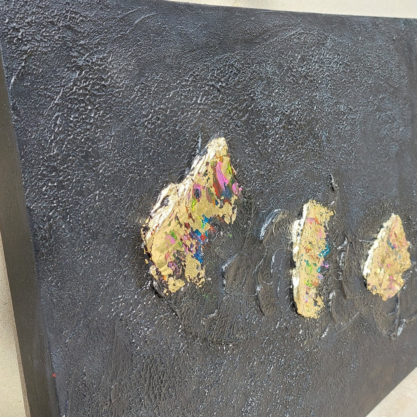 Black and multicolour acrylic canvas art with gold leaf