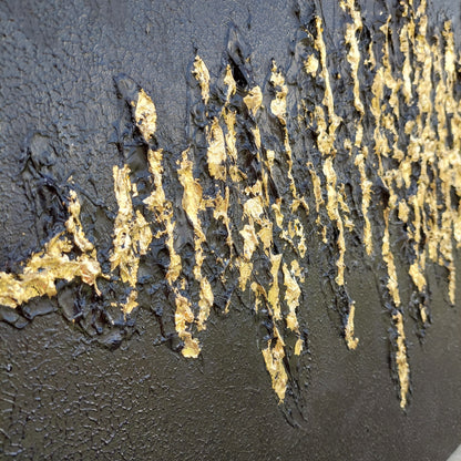 Close up Black textured painting with gold leaf overlay