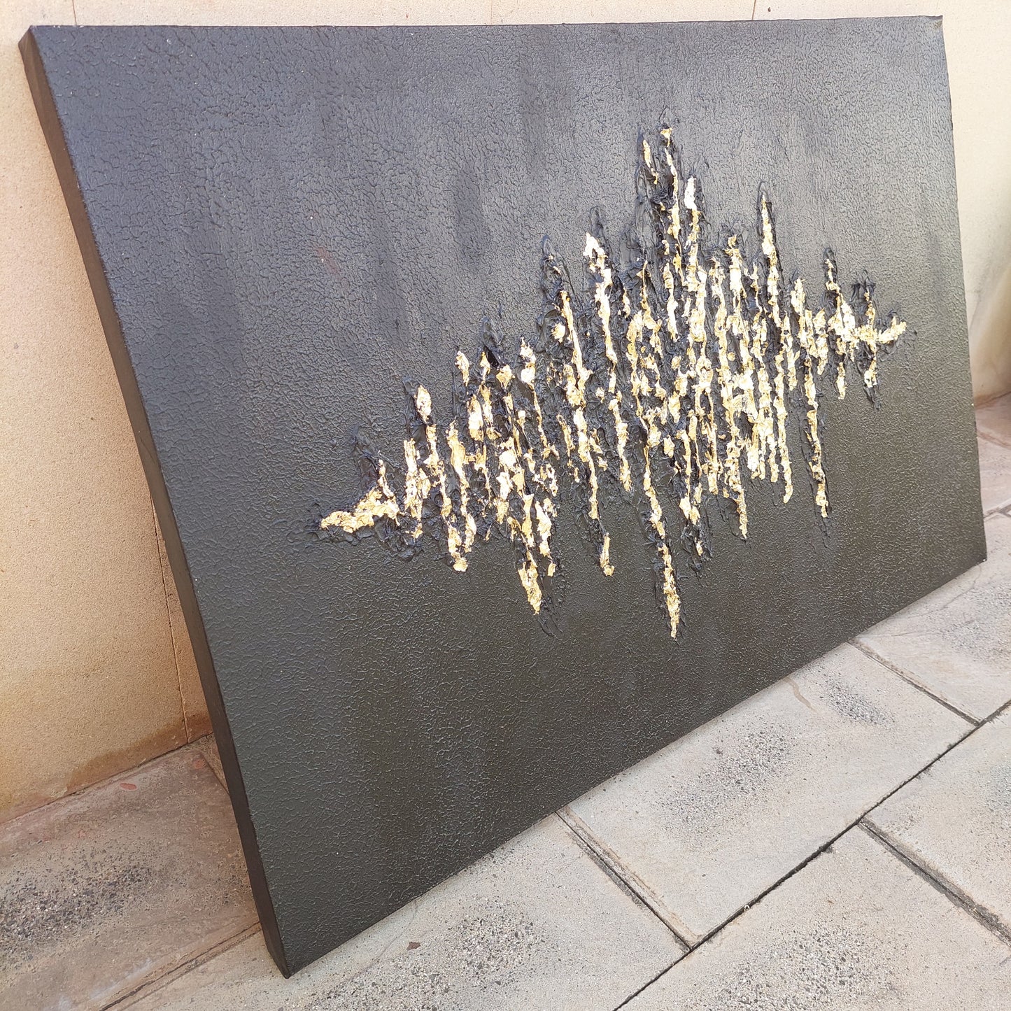 Black textured painting with gold leaf overlay