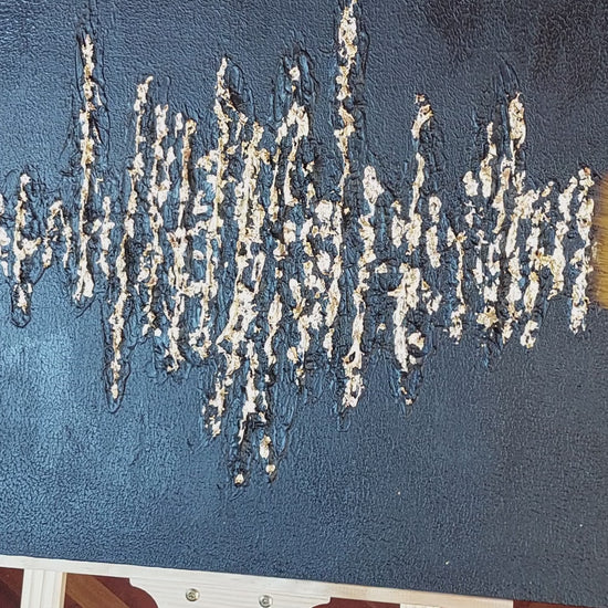 video of close up brushing gold leaf off painting