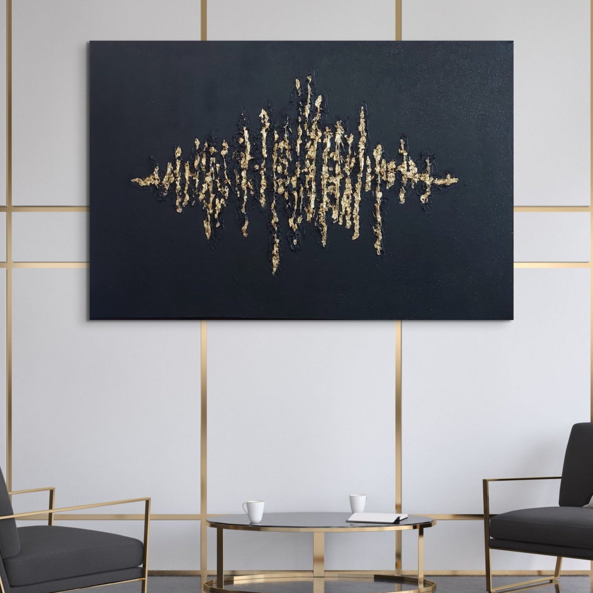 Black textured painting with gold leaf overlay hanging over a coffee table and two grey chairs