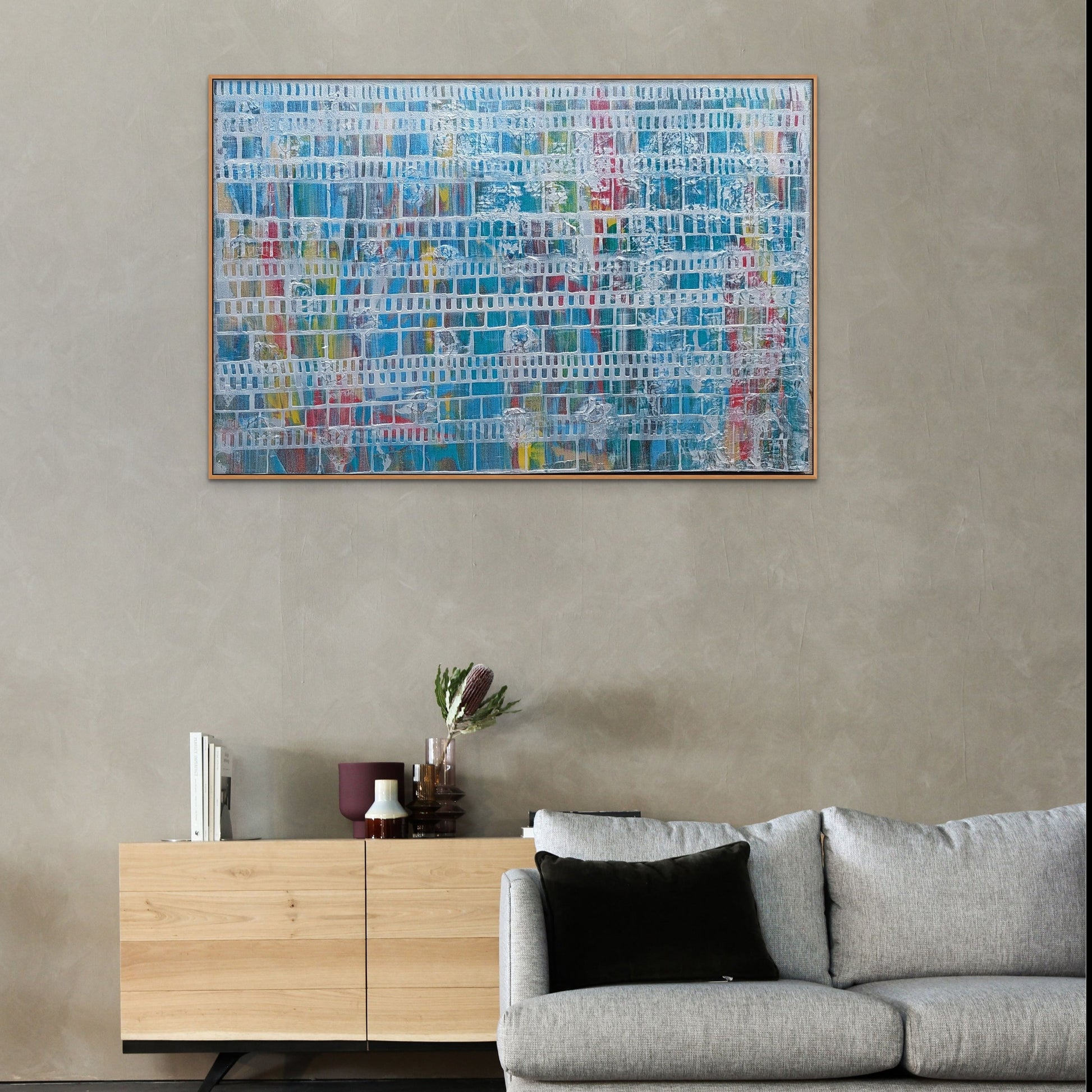 Muli- colour acrylic painting with silver overlay hanging over sofa 